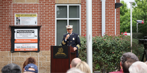 Photo of a Fire Chief standing at a podium
