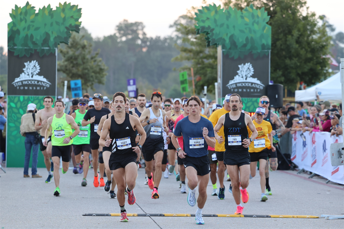 Photo of runners at a race starting line