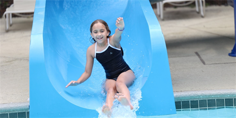 Photo of a blue water slide with child 
