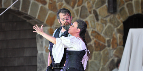 Photo of actors dressed in Shakespeare attire on stage