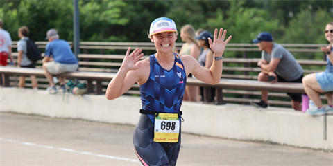 Photo of a smiling runner in The Woodlands Triathlon 