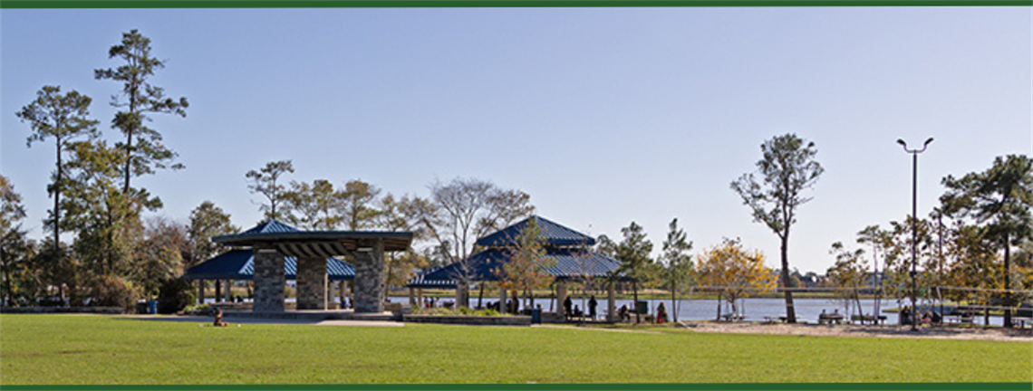 Photo of a green field and pavilion
