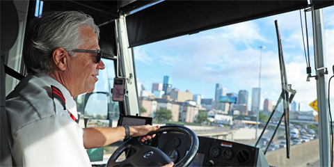 Busdriver with Houston skyline news release photo.png