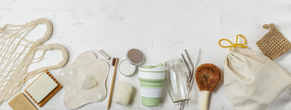 Many items related to zero waste including reusable shopping bag and a travel mug