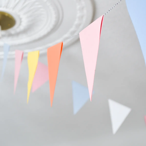 Paper bunting on a string hung from the ceiling