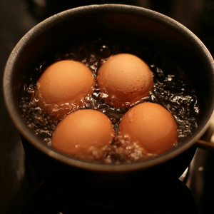 Eggs boiling in a pot