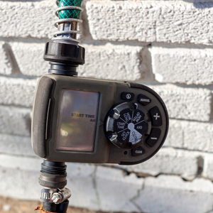 Timer attached to a hose outside