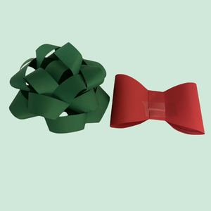 Green paper bow and red paper bow on a light green background