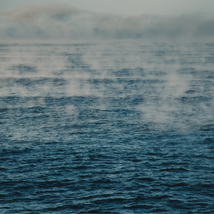 Steam rising from a body of water
