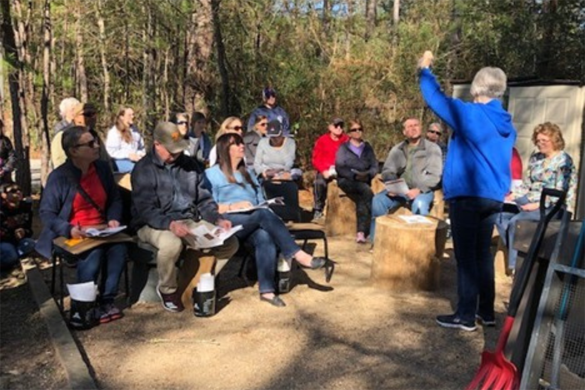 Photo of people sitting in an outdoor setting 
