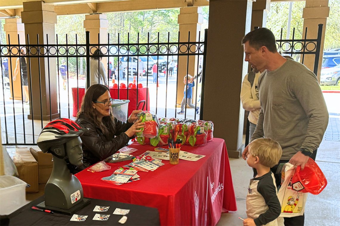 Parent and child looking attending the Safety Fair