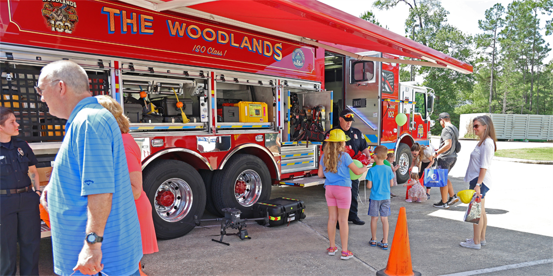 Photo of fire truck and children