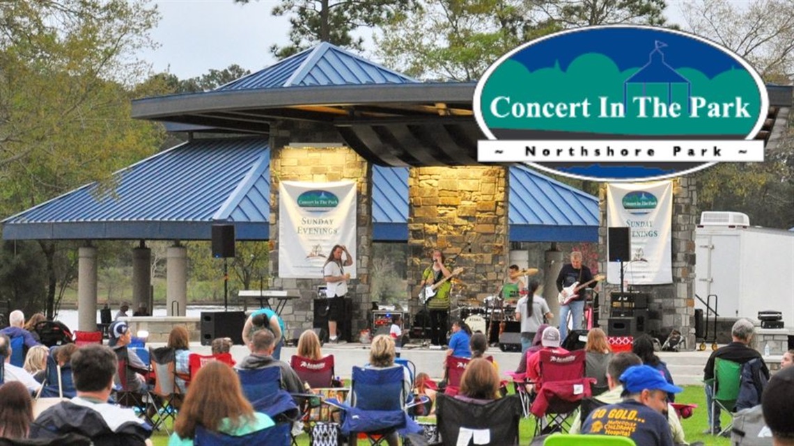 Photo of residents sitting in the park watching a band