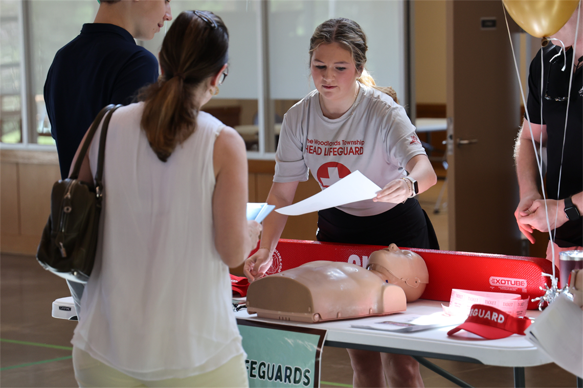 Photo of a girl handing out an job application