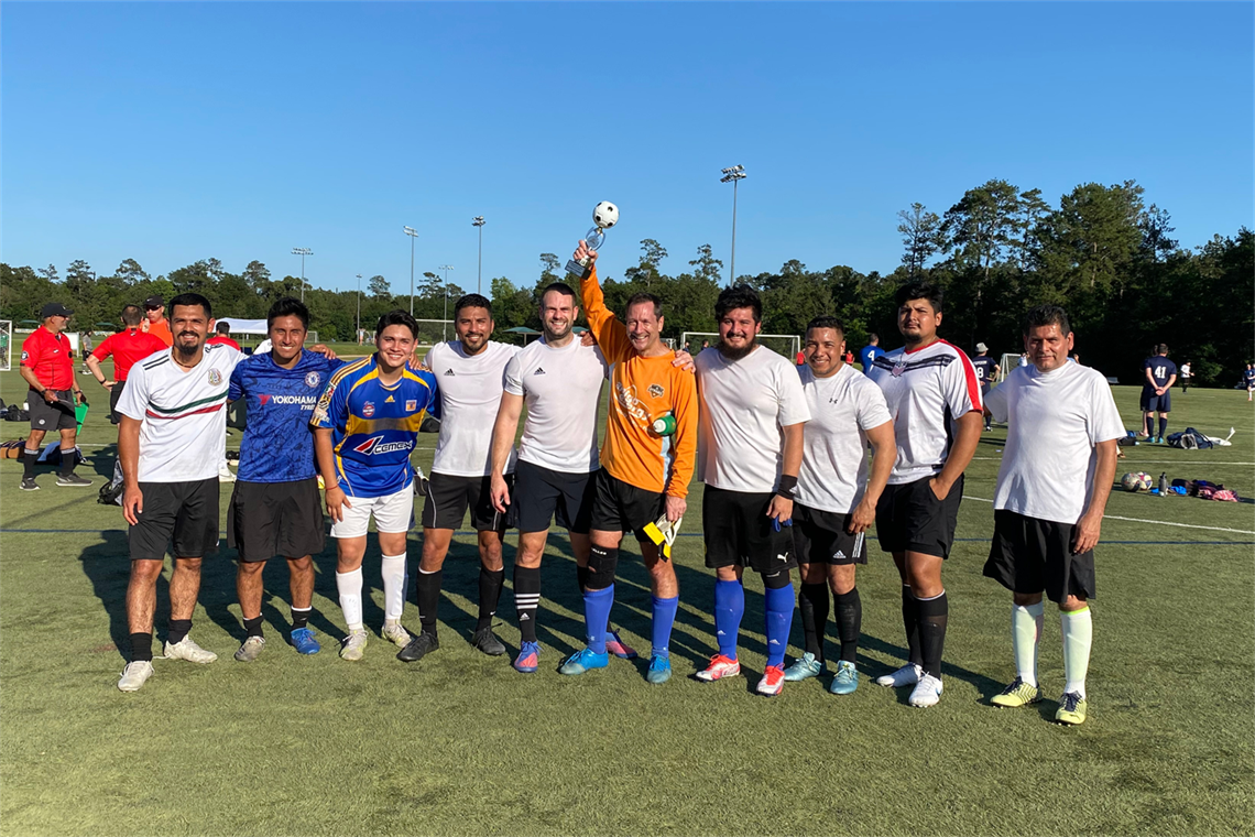 Men standing on a soccer field