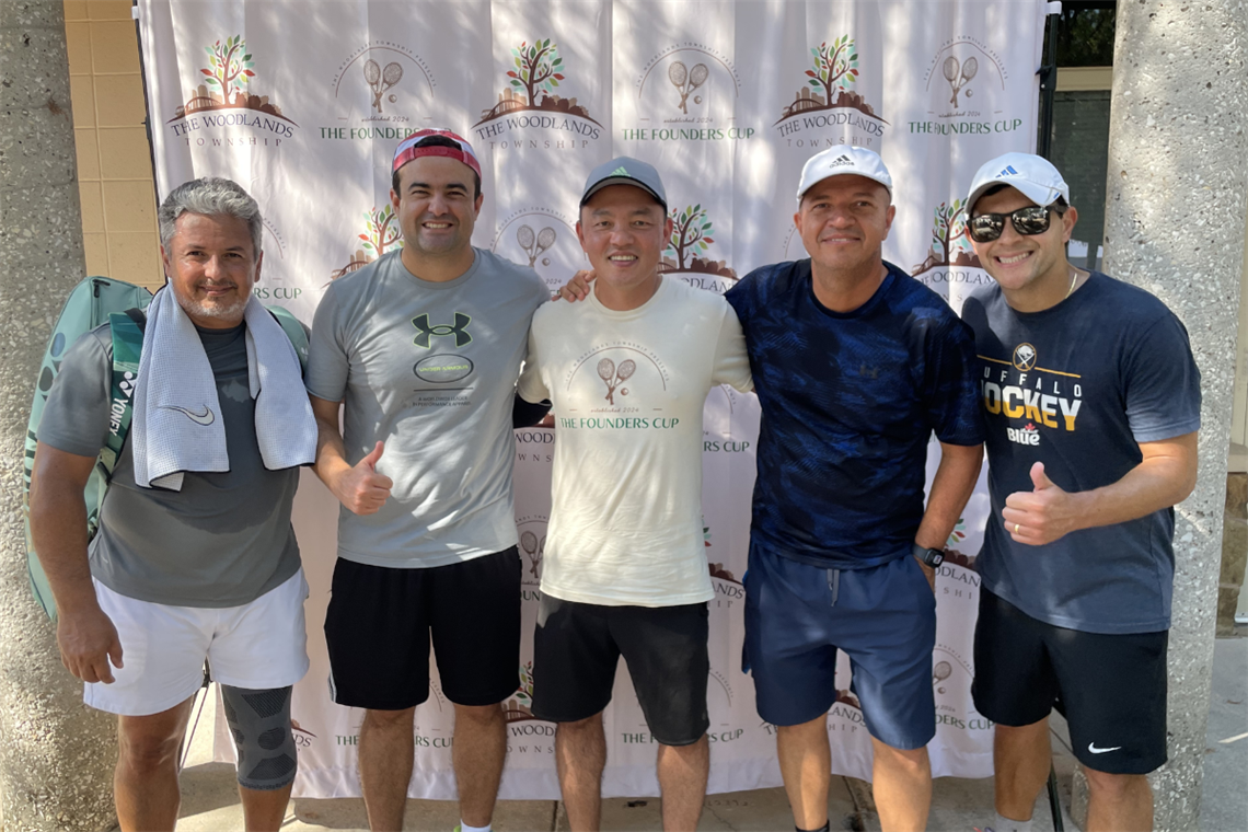Photo of five smiling tennis players after the game