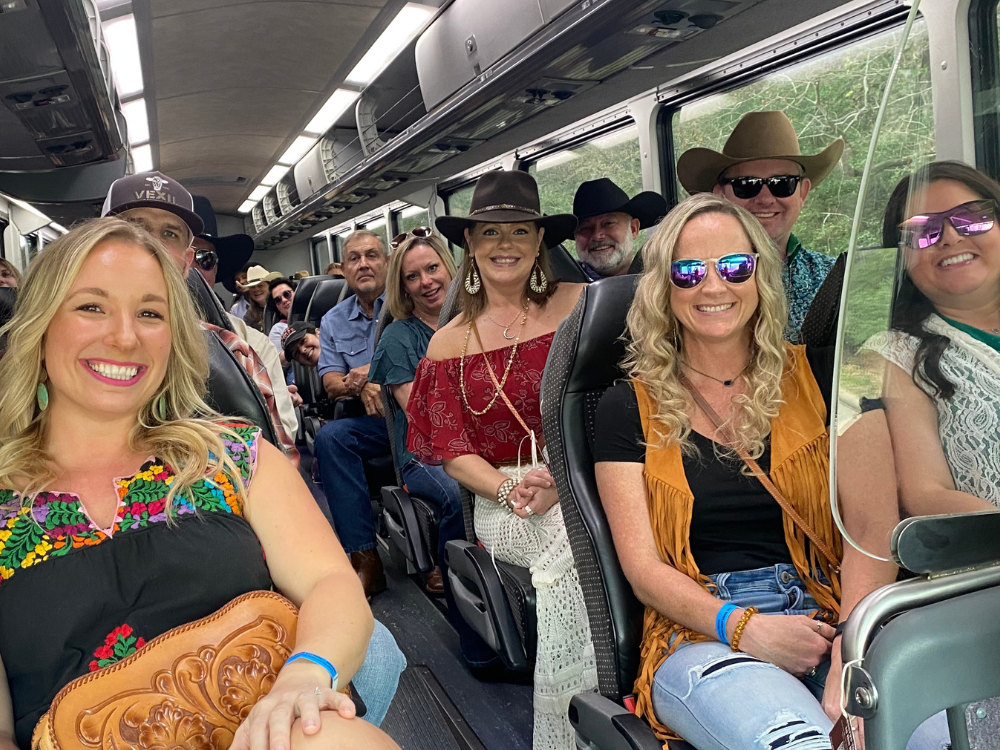 Photo of people riding the Rodeo Express wearing western apparel