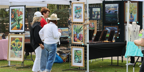 festival participants looking at art
