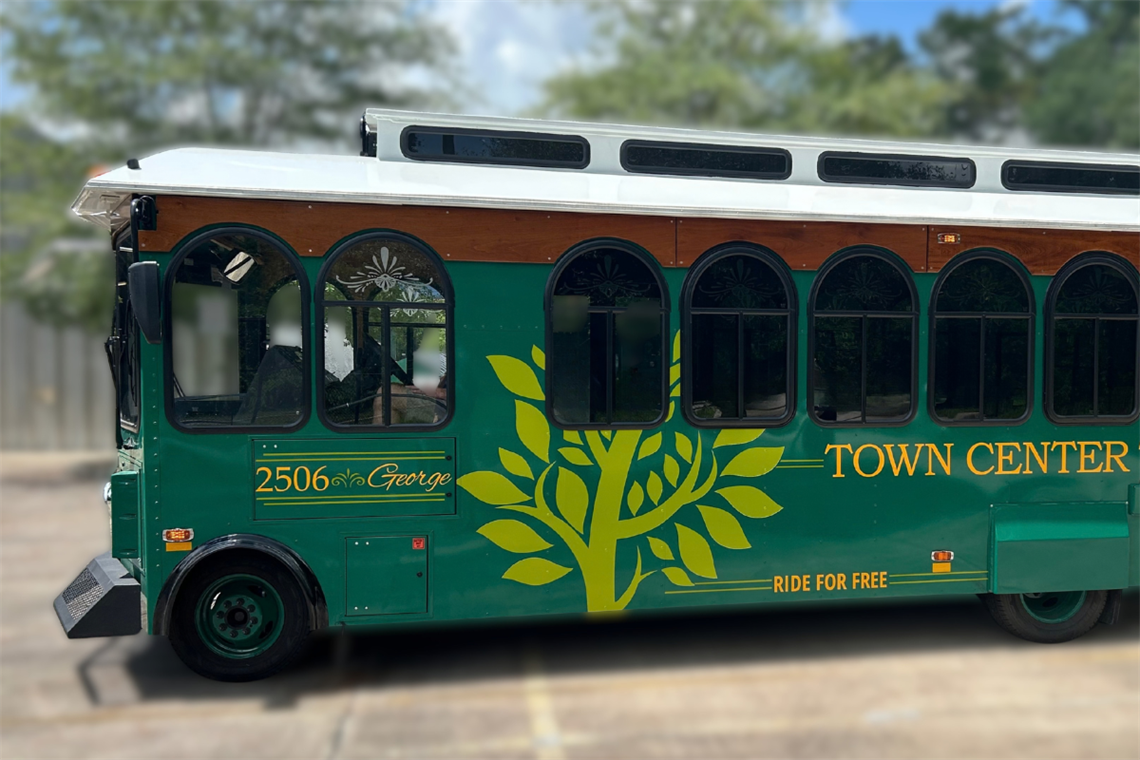 A green and white Town Center trolley
